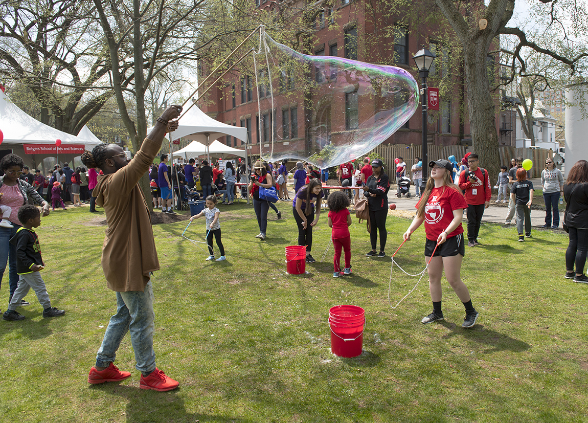 Visitors make big bubbles at Rutgers Day on the College Avenue campus